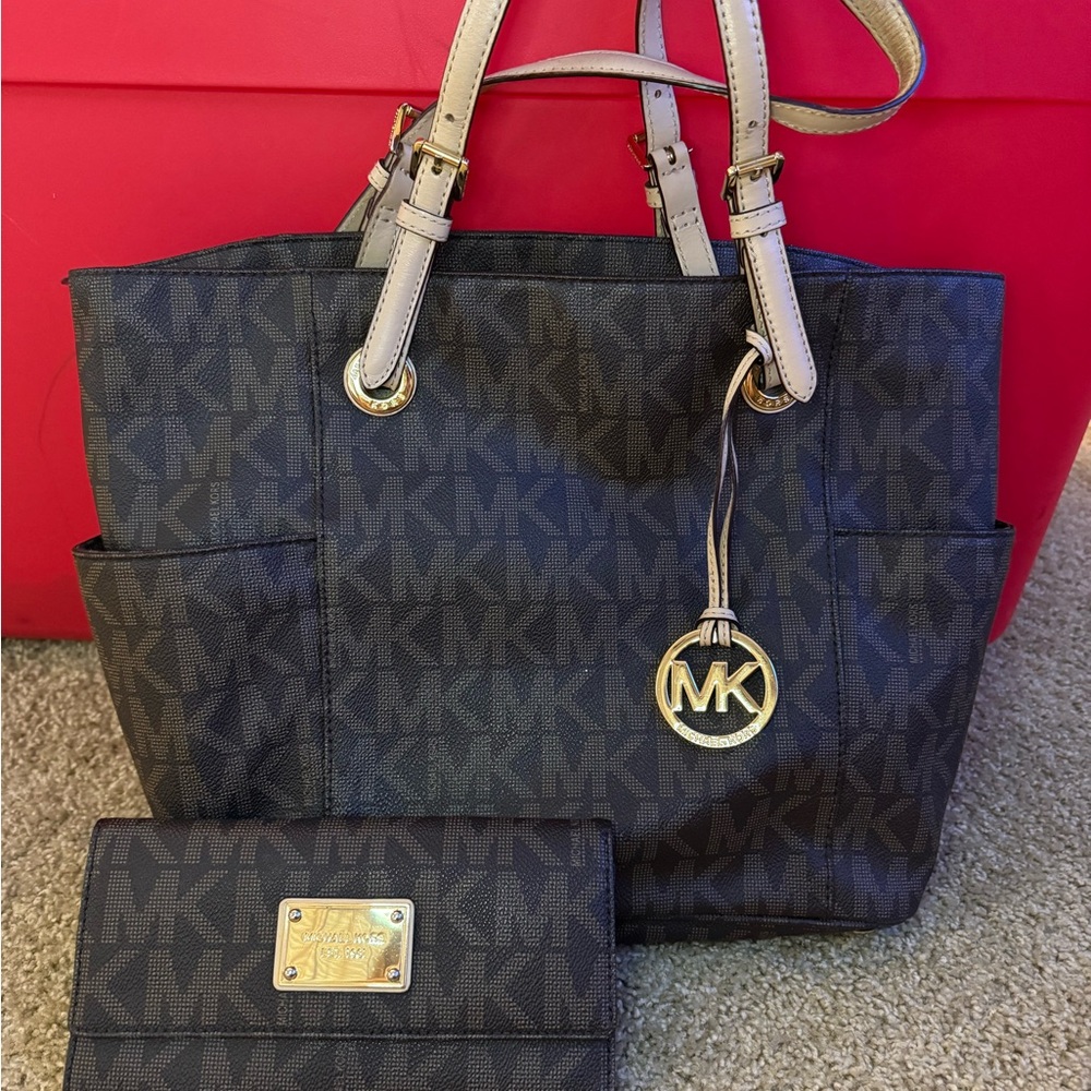Authentic Michael Kors Black and Tan Signature Tote and matching Wallet